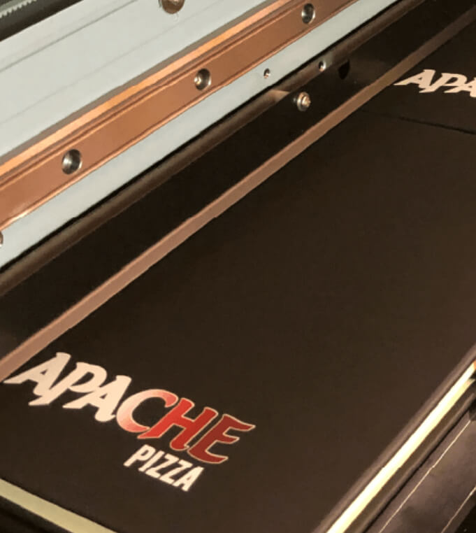 Logo being printed onto a notebook